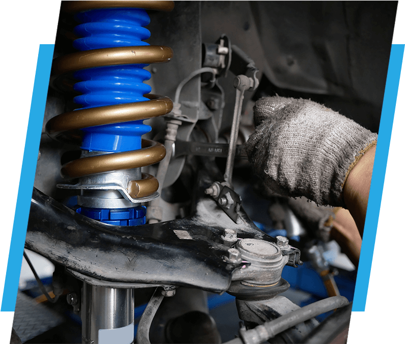 maintaining a car shock absorbers at garage.